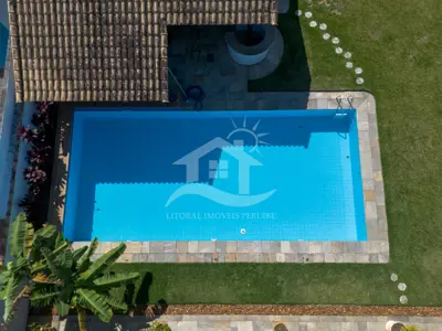 Casa - Térrea com piscina com 3 dormitórios (sendo 2 suite(s)) a 100,00 metros praia.