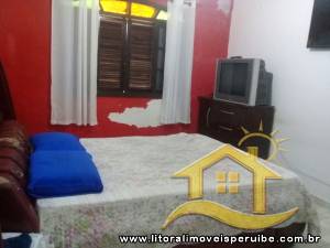 Casa - Térrea com piscina com 4 dormitórios (sendo 1 suite(s)) a 200,00 metros praia.
