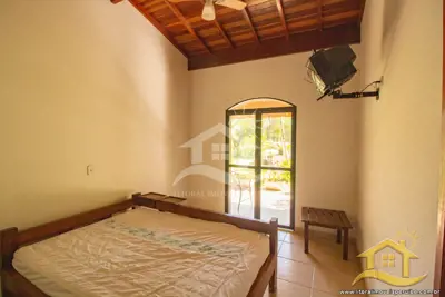 Casa - Térrea com 3 dormitórios (sendo 3 suite(s)) a 0,00 metros praia.