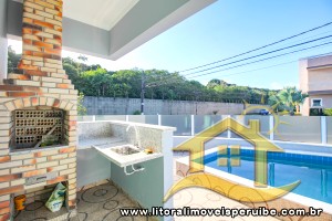 Casa - Térrea com 4 quartos (sendo 4 suite(s)) a 1,00 metros praia.