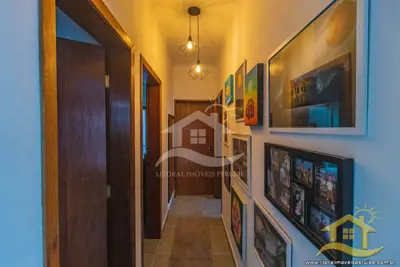 Casa - com Mezanino com 3 dormitórios (sendo 1 suite(s)) a 1,00 metros praia.
