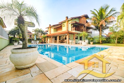 Casa - Assobradada com 5 dormitórios (sendo 2 suite(s)) a 7,00 metros praia.